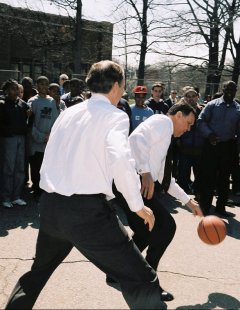 Photo 10: The Secretary also made time, following his visit to the Brown family's new home, to shoot hoops with some local neighborhood residents