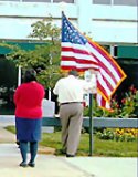 [Photo 1: The American Flag blew gently in the wind, reminding all the participants how our nation stands proud and tall and steadfast.]