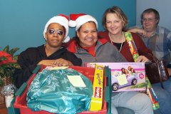 [Photo 3: OSACS and HUD helpers in the holiday spirit]
