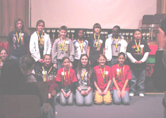 [Photo 1: Individual winners posing for pictures with medals]