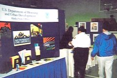 [Photo 3: Fairgoers were greeted by the HUD booth as they entered.]