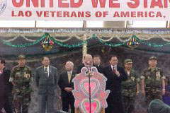 [Photo 3: Former Hmong General Vang Pao speaking to the Hmong people.]