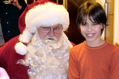 [Photo 3: Santa brings big smiles for all children]