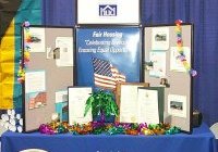 [Photo 3: Fair Housing Forum booth]