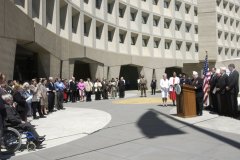 [Photo 1: Secretary Martinez speaking to a crowd of HUD employees and members of veterans' groups.]