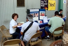 [Photo 4: Representatives from American Savings Bank and First Hawaiian Bank with potential homebuyers.]