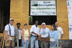 [Photo 1: HUD and USDA volunteers helped build low-income housing in South Carolina.]