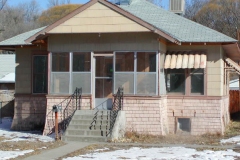 [Photo 1: House before renovations.]