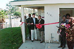 [Photo 3: San Diego Councilman Ralph Inzunza and others at the ribbon-cutting.]