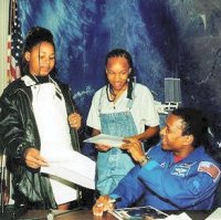 [Photo 2: T-America, Thelma, and Mike.]