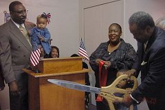 [Photo: Cutting the ribbon]