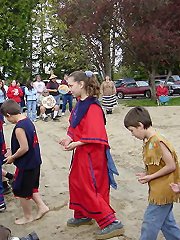 [Photo 2: Children dancing in colorful costumes]
