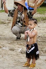 [Photo 3: Mr. Dennis Jones with his little grandson Julani McGinty performing a traditional tribal dance]