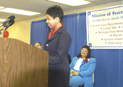 [Photo 2: Sherri Brown thanking the Mission of Peace with Ms Smith sitting in the back]