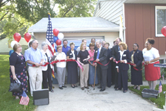 [Photo 4: Iowa government officials with Shannon Rosenbeck cutting the ribbon at the ceremony]
