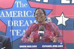 [Photo 1: Sonia Tate Smith speaking at the microphone]