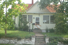 [Photo 1: Home before renovation]