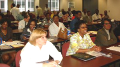 [Photo 1: Attendees at the two-hour presentation on the homebuying process]