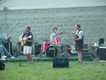 [Photo 1: The band rocking]