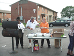 [Photo 5: Three of HUD directors preparing their barbecue]