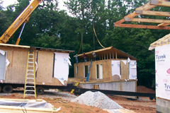 [Photo 1: A house is being built by the Heritage High School students]