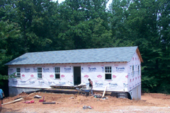 [Photo 2: The home for Habitat for Humanity is under construction]