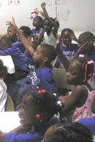 [Photo 1: Children enthusiastically participating in sharing their dreams]
