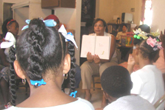 [Photo 2: Children listening to a Dr. Seuss story]