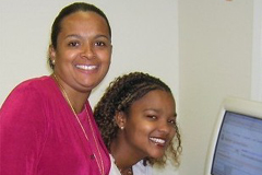[Photo 1: Two ladies at a computer]