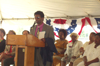 [Photo 2: Resident Craig Ferrel speaking from the podium]