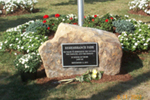 [Photo 3: The inscription on the 'Remembrance Park' on a stone says, 'We pause to remember the victims, the families, and the heroes in honor of those lost on September 11, 2001']
