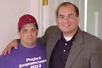 [Photo 2: Homeowner Jimmy Norris with a Fannie Mae official]