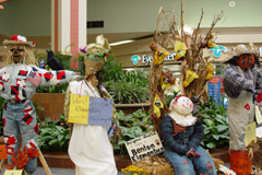 [Photo 3: Left to right: patriot, a voodoo queen, and a scarecrow who grows Pepsi]