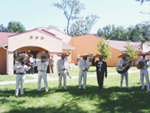 [Photo 3:  Aztec dancers and a mariachi band in front of the San Jose Mission]