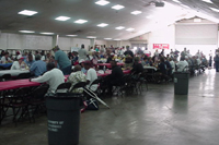 [Photo 1: People are getting their meals and others attending Operation Stand Down]