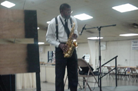 [Photo 3: Clinton Johnson playing his sax]