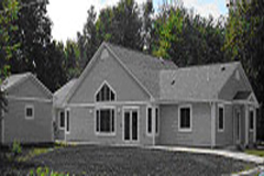[Photo 2:  Exterior of the house]
