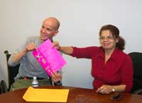 [Photo 2: Christian and Christina with keys to their new home.]