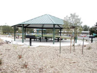 [Photo 2: Covered picnic area in new park]
