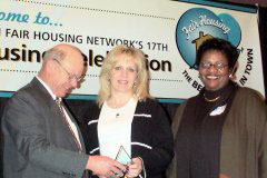 [Photo 3: Lisa Maloney receives the Professional Fair Housing Award.]