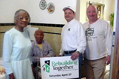 [Photo 1:  HUD representatives pay a courtesy call on Carolyn and Orbie Tate, the home owners.]