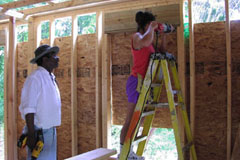 [Photo 2: Gregorie and a United Methodist Relief Center volunteer helped build several homes.]