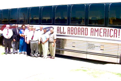 [Photo 1: Tour bus, Lubbock Field Office staff, and Midland Affordable Housing Partnership representatives.]