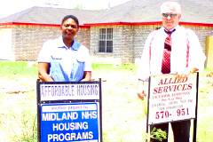 [Photo 3: Wanda C. Merritt and Ronnie Browning in front of Pam Chambers' new home.]