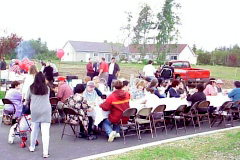 [Photo 1: Festivities, tribal members, and invited guests at an open house]