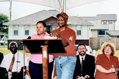 [Photo 3: New homeowners Frances and Iishia Hatcher at the grand opening]