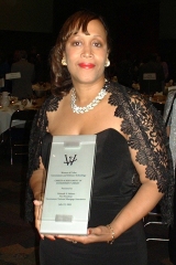 [Photo: Ms. Holmes received the prestigious 2002 Career Achievement in Government award.]
