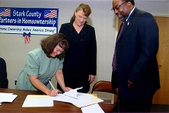 [Photo: HELP potential homeowners agreement is signed in Stark County, Ohio.]