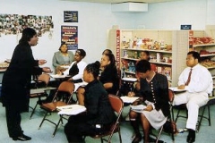 [Photo 3:  Students learn skills to work at Walgreens]