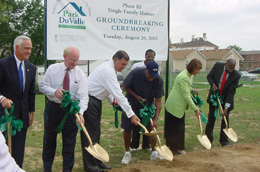 [Photo 3: Dignitaries break ground for the third phase at Park DuValle.]